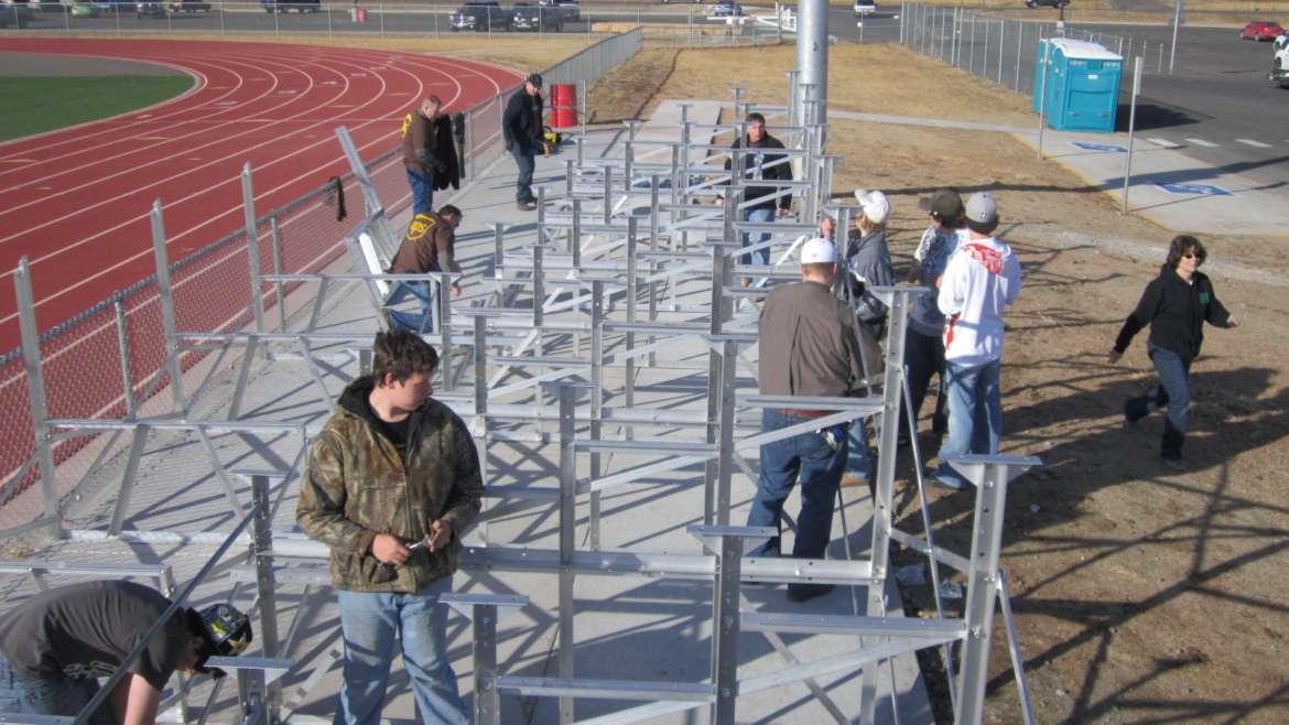 FC BOCES Green Construction students help construct new bleachers at Wolverine Field
